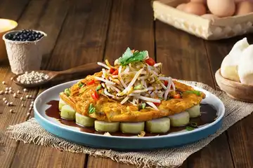 Illustrasi Tahu Tek Telur