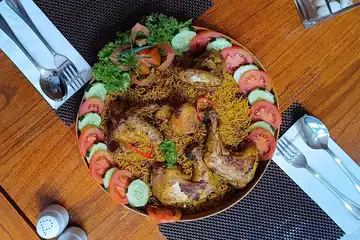 Ilustrasi resep membuat nasi kebuli menggunakan beras biasa, bisa dibuat di rumah.